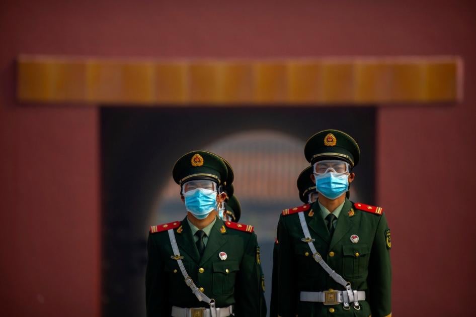 Chinese paramilitary police wear face masks in Beijing, May 1, 2020.