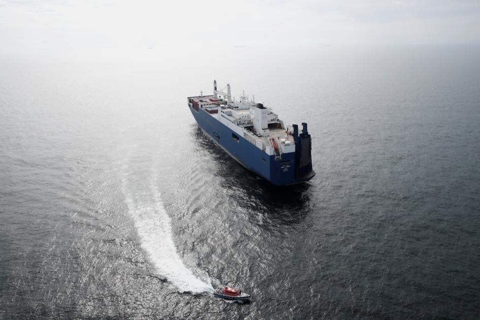 French human rights activists wave flags as they demonstrate in front of Saudi cargo ship Bahri Tabuk docked at le "Grand Port Autonome de Marseille" GPAM in Port-Saint-Louis-du-Rhone, on May 29, 2019.