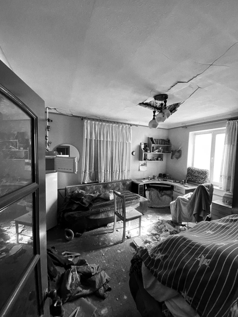 Damaged homes on Italyanskaya Street in Mariupol