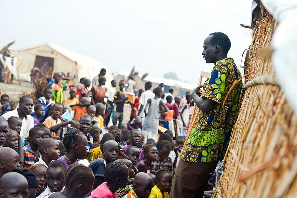 A math teacher in the UNMISS camp near Bentiu teaching boys and girls. The vast majority of camp inhabitants are children and women. 