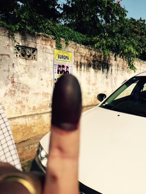 A Shan man who voted in 1990, 2008, and 2010, proudly shows his ink stained finger after voting in Taunngyi, Shan State. He joined the polling station at 6 a.m., and waited patiently for one hour to cast his vote.