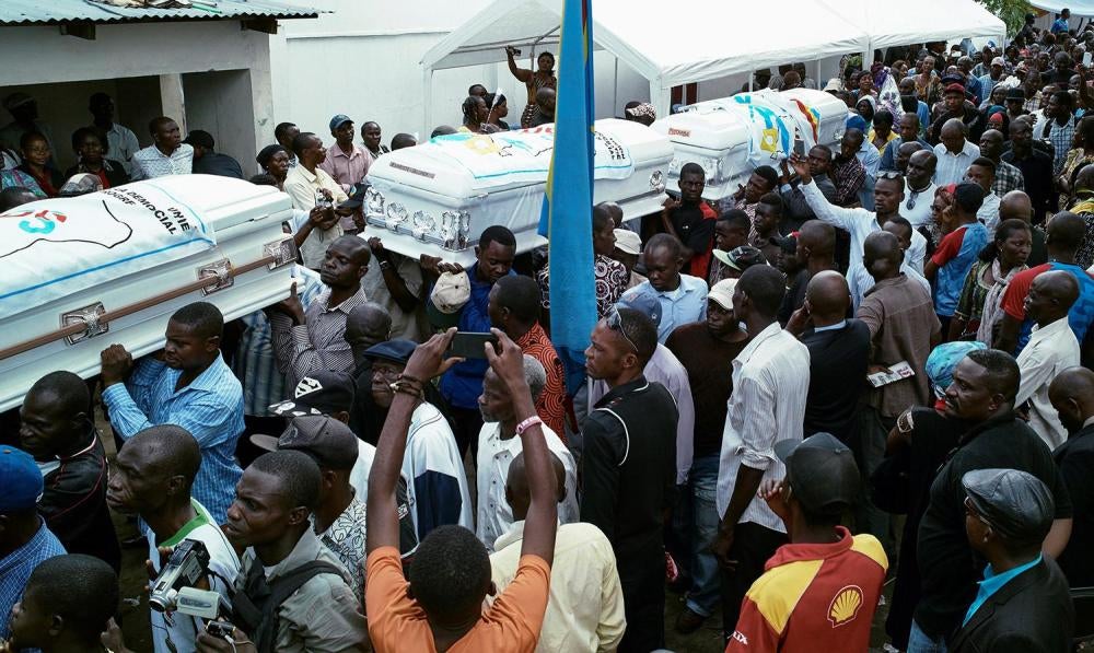 Mourners carry coffins of protesters killed in the September 19 and 20 demonstrations during a ceremony organized by the opposition Union for Democracy and Social Progress (UDPS), Kinshasa, Democratic Republic of Congo, November 1, 2016. 