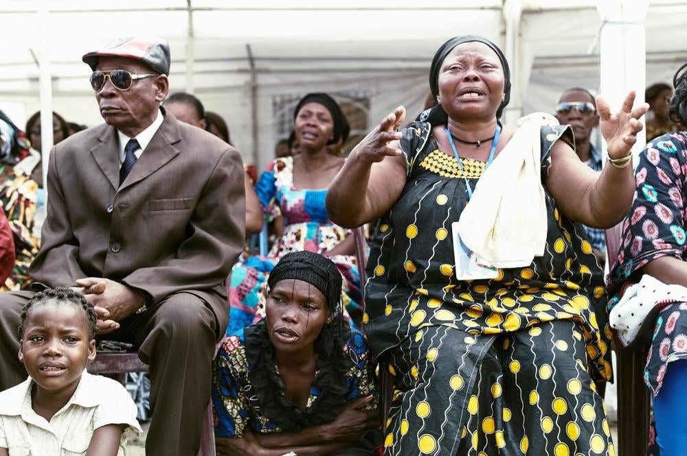 Relatives mourn protesters killed in the September 19 and 20 demonstrations during a funeral ceremony at the opposition Union for Democracy and Social Progress (UDPS) headquarters in Kinshasa, Democratic Republic of Congo, October 31, 2016. 