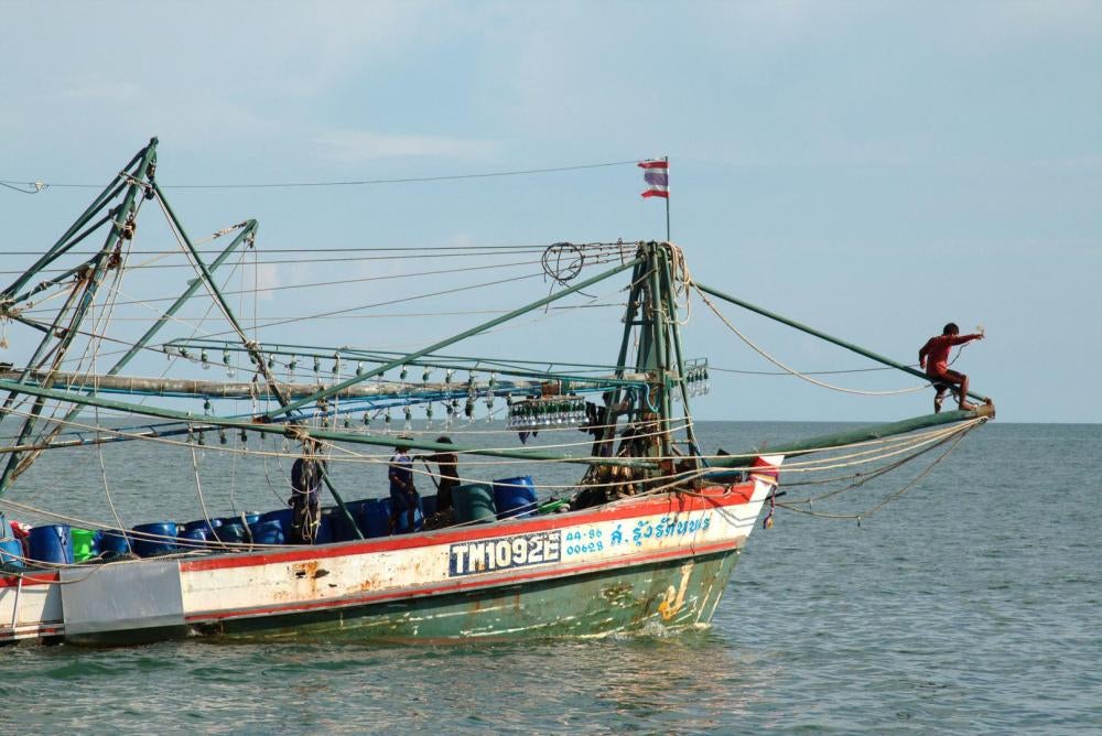 A falling netter departs from a private pier in Laem Ngop, Trat, November 9, 2016.