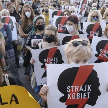 Protesters with a banner reading "Women's Strike" take part in a rally against the Polish government’s plans to withdraw from the Istanbul Convention on prevention and combating of domestic violence, in Warsaw, Poland, July 24, 2020. © 2020 AP Photo/Czarek Sokolowski
