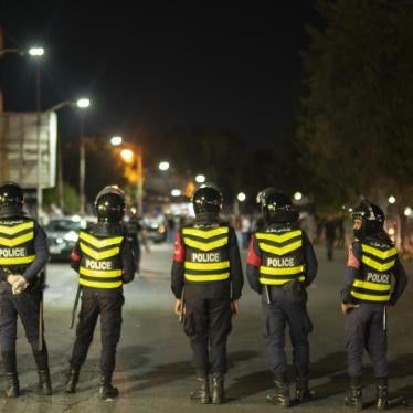  Jordanian police block a road in front of protestors in Irbid, north of Jordan on August 1, 2020.