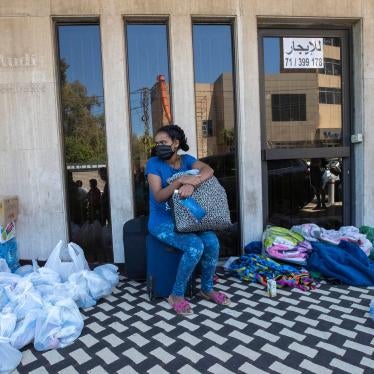 An Ethiopian domestic worker waits in front of the Ethiopian consulate after she and others were abandoned by their Lebanese employers, in Hazmieh, east of Beirut, Lebanon, June 4, 2020.