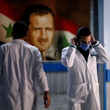 A health worker with a face mask walks inside a hospital, as hospitals enforce a series of measures to prevent the spread of the coronavirus disease (COVID-19), in Damascus, Syria March 19, 2020. 