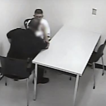An image of a police officer interrogating a youth, using techniques that ultimately pressured the youth to confess to a crime he did not commit.  ​