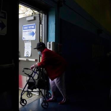 A woman departs the Beethoven Elementary School after participating in early voting in Chicago, October 15, 2020. 