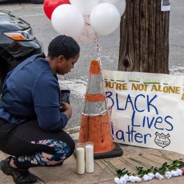A neighbor gathers at a memorial outside Walter Wallace Jr.'s home in Philadelphia, Pennsylvania, October 27, 2020.