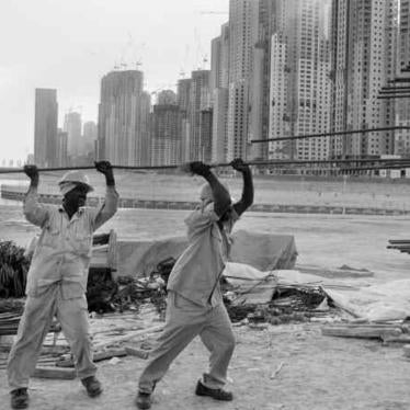 Foreign laborers work to build the Jumeirah Beach luxury apartment complex. 