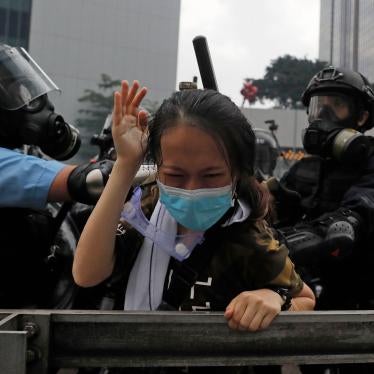 A protester is tackled by riot police during a demonstration outside the Legislative Council in Hong Kong, June 12, 2019.