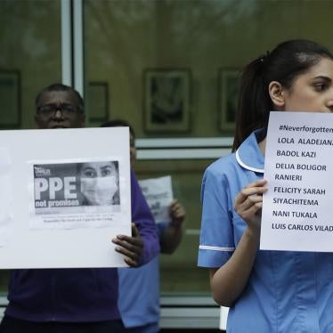 Hospital workers remember their colleagues who have died from coronavirus and call on UK health authorities to provide personal protective equipment at University College Hospital in London, April 2020.