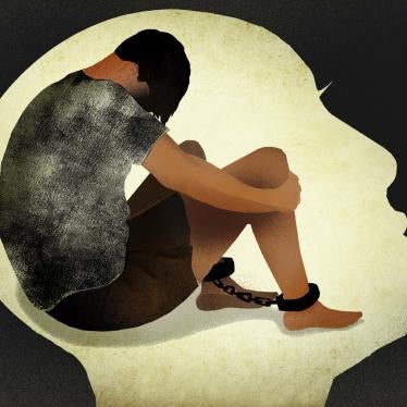 An illustration of a man sitting in ankle chains