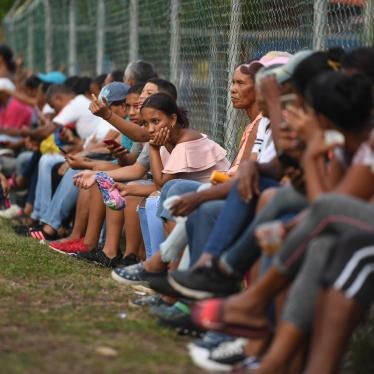 Relatives and friends of Venezuelan migrants who died when a boat transporting them to Trinidad and Tobago sank, wait for news of the recovery of their bodies, in Güiria, Venezuela, on December 18, 2020.