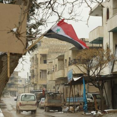 A Syrian flag flies in the city of Maarat al-Numan, near Idlib, Syria, February 12, 2020.
