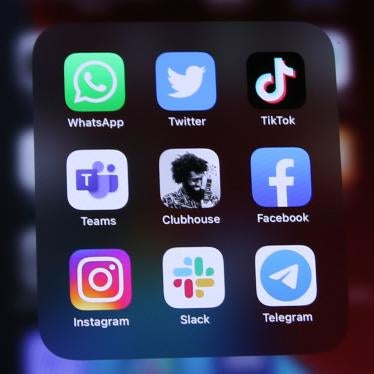 Logos of social media platforms including Clubhouse, center, are seen on an iPhone 12.