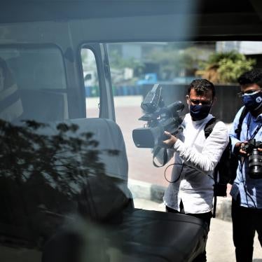 Journalists work in front of a Covid-19 Hospital in Dhaka, Bangladesh on April 20, 2021. 