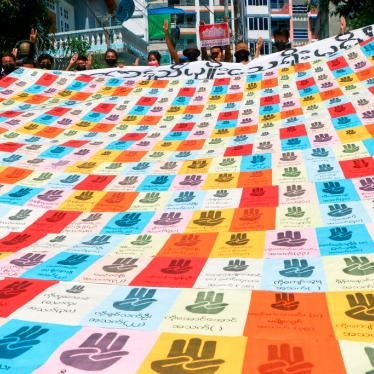 Demonstrators pose banner military coup 