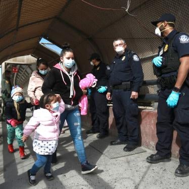 A migrant family crosses the border into El Paso, Texas, in Ciudad Juarez, Mexico, Friday, Feb. 26, 2021.