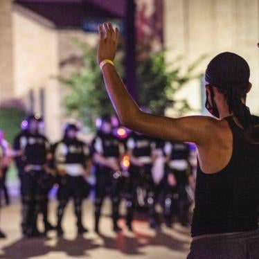 A protester puts his hands up in front of a line of police in riot gear in the US city of Columbus, Ohio, on June 5, 2020.