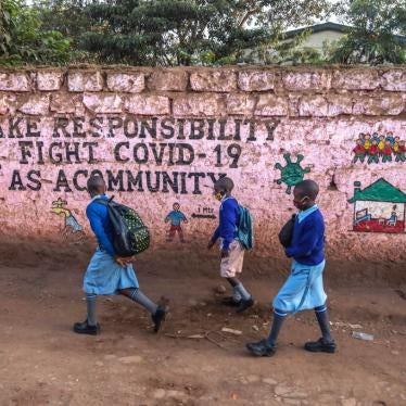 Pupils wearing facemasks head to school following the reopening of schools after nine months of no school due to the coronavirus pandemic in Nairobi, Kenya, January 4, 2021.