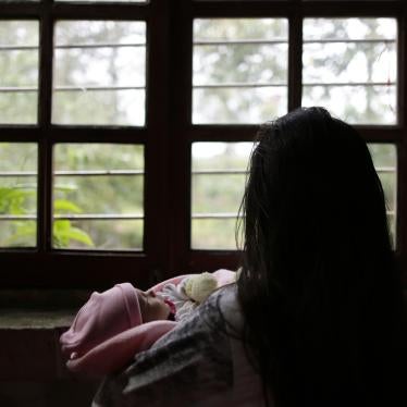 A 13-year-old girl victim of rape in a separate case holds her one-month old baby at a shelter in Ciudad del Este, Paraguay, on May 14, 2015.