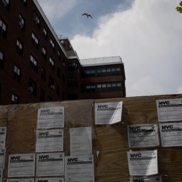 Work permits displayed in front of an apartment complex