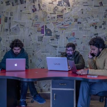 Fahad Shah, right, editor-in-chief of the Kashmir-based news website, The Kashmir Walla, in his office in Srinagar, India, January 21, 2022.