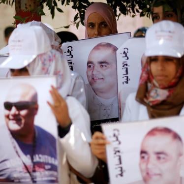 Palestinian demonstrators hold posters of Mohammad al-Halabi
