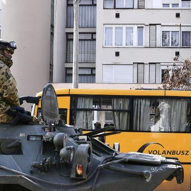 A troop rides in an armored personnel carrier