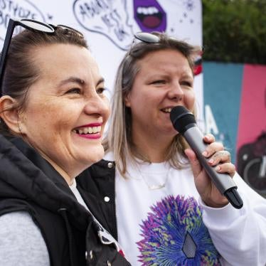 Justyna Wydrzyńska (left) and a colleague from the group Abortion Dream Team address a gathering in Warsaw city center to share the experiences of people who needed abortions, September 28, 2021.