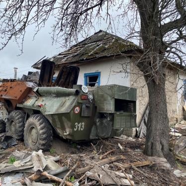 An abandoned Russian armored vehicle parked next to a home in Yahidne village, April 17, 2022. 