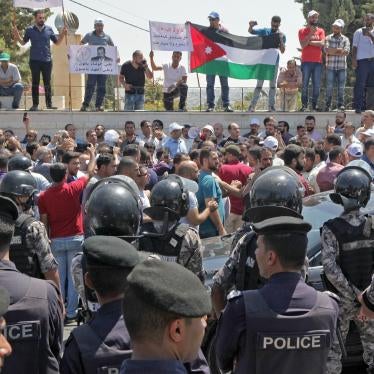 Jordanian teachers display their national flag during a protest in the capital of Amman on September 5, 2019.