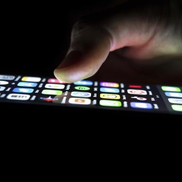 A man looks at the apps on his phone.