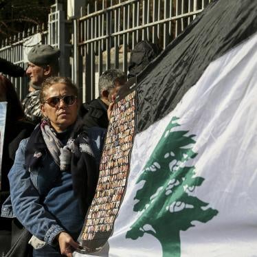 Lebanese activists and families of the victims of the 2020 Beirut port blast gather outside the Palace of Justice to protest a decision by Lebanon's top prosecutor to release the suspects detained in connection with the explosion. 