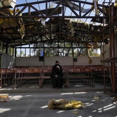 A woman at the site of a suicide attack on an education center claimed by a group affiliated with the Islamic State, in Kabul, Afghanistan.