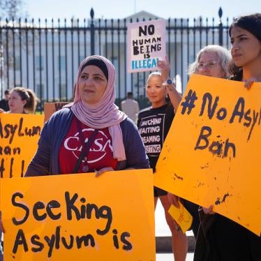 Protesters with the #WelcomeWithDignity campaign and Interfaith Immigration Coalition hold signs in opposition to Biden administration's asylum ban, outside of the White House in Washington, DC, February 23, 2023. 