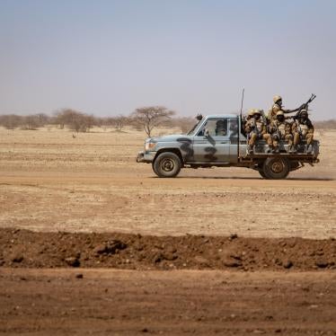 Burkina Faso soldiers patrol aboard a pickup truck on the road from Dori to the Goudebo refugee camp, on February 3, 2020. 