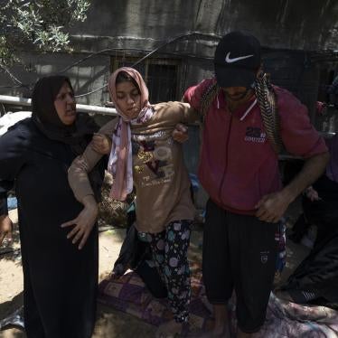 Haneen Nabhan, who has physical and intellectual disabilities, next to the ruins of her family’s home in the Jabaliya refugee camp in Gaza, which was destroyed in an Israeli airstrike on May 14, 2023. 