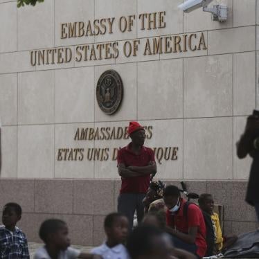 People displaced by armed gangs from their homes in the Tabare neighborhood rest outside the U.S. embassy in Port-au-Prince, Haiti, July 25, 2023. 