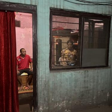 Purna’s wife, Kabita, preparing dinner the night before his dialysis while he assists, Butwal, Nepal, July 19, 2023.