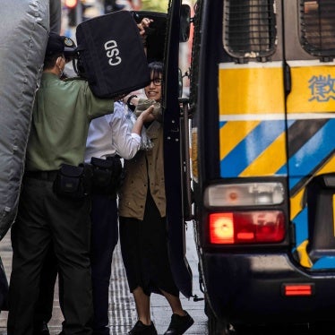 Chow Hang-tung (R) arrives at the Court of Final Appeal in Hong Kong on June 8, 2023.