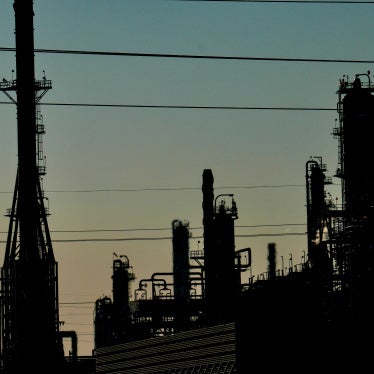 Silhouetted industrial plant