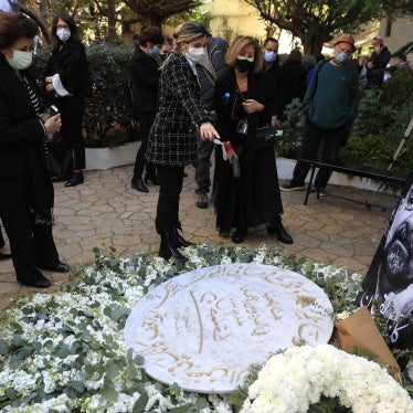 Mourners and activists at a monument for Lokman Slim during his memorial service, Beirut, Lebanon, February 11, 2021.