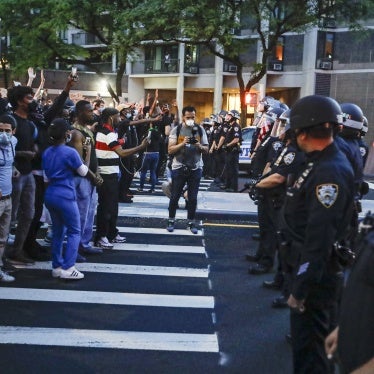 Protesters confront New York Police officers as part of a solidarity rally calling for justice over the death of George Floyd, in the Brooklyn, New York, June 3, 2020. 