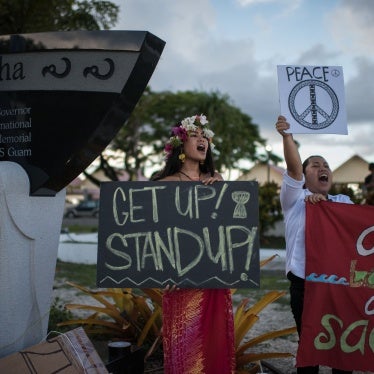 Members of community groups calling for the "de-colonization and de-militarization of Guam" attend a "People for Peace" rally in Hagatna on August 14, 2017.