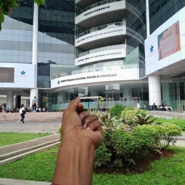 A Morning Star flag bracelet worn on a person's wrist