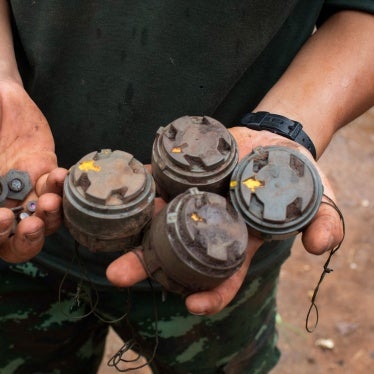 A member of the opposition Karenni Nationalities Defence Force holds antipersonnel mines planted by the Myanmar military and removed during demining operations near Pekon township, July 11, 2023.